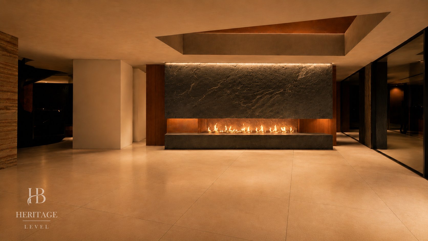 Double-height living room of KEYSTONE, at night, with the fireplace lit